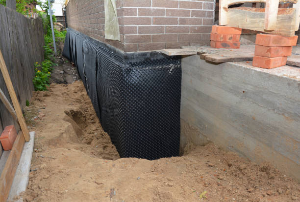 Happy homeowners after waterproofing job in Long Branch